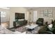 Comfortable living room with elegant decor, plush rug, and a modern entertainment center at 158 Torain St, Hillsborough, NC 27278