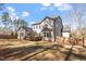Large home with a fenced in yard, deck, and bay windows at 1705 Yates Pond Way, Raleigh, NC 27606