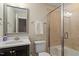 This bathroom features a vanity with modern fixtures and a glass-enclosed shower at 1705 Yates Pond Way, Raleigh, NC 27606