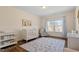 Cozy Bedroom with a crib, changing table, and a comfortable chair, perfect for a new Gathering at 1705 Yates Pond Way, Raleigh, NC 27606