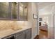 Elegant butler's pantry with custom cabinetry, marble countertops, and a wine refrigerator at 1705 Yates Pond Way, Raleigh, NC 27606