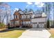 Charming two-story home with a 2-car garage and a beautifully landscaped front yard at 1705 Yates Pond Way, Raleigh, NC 27606