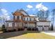 Beautiful two-story home with stone accents, neutral siding, and a well-manicured lawn at 1705 Yates Pond Way, Raleigh, NC 27606