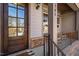Elegant front door with glass panels, sidelights and a welcoming porch at 1705 Yates Pond Way, Raleigh, NC 27606
