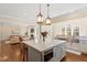 Bright, eat-in kitchen featuring granite countertops, stainless steel appliances, and an island with seating at 1705 Yates Pond Way, Raleigh, NC 27606