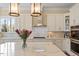 Contemporary kitchen featuring stainless steel appliances, a tile backsplash, and a breakfast bar at 1705 Yates Pond Way, Raleigh, NC 27606