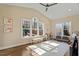 Bright living space featuring hardwood floors, neutral walls, and large windows overlooking a spacious yard at 1705 Yates Pond Way, Raleigh, NC 27606