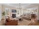 Spacious living room with a fireplace, hardwood floors, and an open layout at 1705 Yates Pond Way, Raleigh, NC 27606