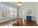 Well-lit home office with hardwood floors, a large window, and ample space for a desk and storage at 1705 Yates Pond Way, Raleigh, NC 27606