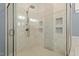 Tiled glass shower featuring shower head with multiple jets and built-in shower caddy at 1705 Yates Pond Way, Raleigh, NC 27606