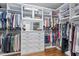 Organized walk-in closet featuring custom shelving, drawers, and ample hanging space for clothes and accessories at 1705 Yates Pond Way, Raleigh, NC 27606