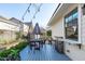 Cozy back deck features string lights, table, and outdoor furniture, perfect for entertaining at 202 Duncan St, Raleigh, NC 27608