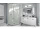 Bright bathroom boasts a corner glass shower, a modern vanity, and elegant fixtures at 202 Duncan St, Raleigh, NC 27608