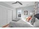 Cozy bedroom featuring a ceiling fan, closet space, window and natural light at 202 Duncan St, Raleigh, NC 27608