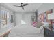 Bright bedroom features a ceiling fan, natural light, and closet for storage at 202 Duncan St, Raleigh, NC 27608