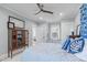 Cozy bedroom with a ceiling fan, window seat and a cabinet for storage at 202 Duncan St, Raleigh, NC 27608