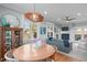 Comfortable dining area features a round table, bright light fixture, and backyard view at 202 Duncan St, Raleigh, NC 27608