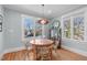 Charming dining room features a round table with wicker chairs and natural light at 202 Duncan St, Raleigh, NC 27608
