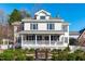 Charming two-story home with a inviting front porch and beautiful landscaped front yard at 202 Duncan St, Raleigh, NC 27608