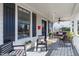Relaxing front porch with comfortable seating, ceiling fan, and stylish decor at 202 Duncan St, Raleigh, NC 27608