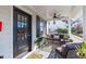 Cozy front porch with comfortable seating, a ceiling fan, and charming outdoor decor at 202 Duncan St, Raleigh, NC 27608