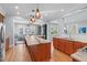 Open-concept kitchen flows into living areas, offering a large island, stainless appliances, and abundant light at 202 Duncan St, Raleigh, NC 27608