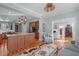Open floor plan seamlessly connects the living room and kitchen, with hardwood floors and modern lighting at 202 Duncan St, Raleigh, NC 27608