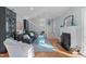 Elegant living room with a fireplace, comfortable seating, and hardwood floors at 202 Duncan St, Raleigh, NC 27608
