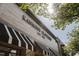 Low angle shot of Kannon's Clothing exterior sign against the sky at 202 Duncan St, Raleigh, NC 27608