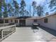 A large deck provides ample space for outdoor seating, dining, and backyard enjoyment at 205 Old Greensboro Rd, Chapel Hill, NC 27516