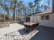 Back deck with dining table, perfect for outdoor gatherings at 205 Old Greensboro Rd, Chapel Hill, NC 27516