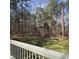 Backyard features lush green space and trees, providing privacy at 205 Old Greensboro Rd, Chapel Hill, NC 27516