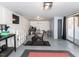 Finished basement features a workout area, TV, storage, and access to the backyard at 205 Old Greensboro Rd, Chapel Hill, NC 27516