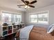 Inviting bedroom featuring a sunlit window with woodland views and built-in storage at 205 Old Greensboro Rd, Chapel Hill, NC 27516
