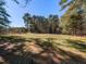 Open, grassy yard ideal for recreation or future landscaping at 205 Old Greensboro Rd, Chapel Hill, NC 27516
