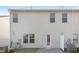 Backyard of the home featuring a door, windows, and an air conditioning unit at 211 Explorer Dr # 263, Morrisville, NC 27560