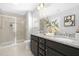 Bathroom featuring dual sinks, granite countertops, and a tiled walk-in shower at 211 Explorer Dr # 263, Morrisville, NC 27560
