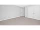 Bedroom featuring plush carpet and a double door closet for ample storage at 211 Explorer Dr # 263, Morrisville, NC 27560