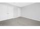Bedroom featuring plush carpet and double door closet for ample storage at 211 Explorer Dr # 263, Morrisville, NC 27560