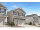 Well-maintained two-story home featuring a clean driveway and attractive landscaping at 211 Explorer Dr # 263, Morrisville, NC 27560
