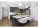 Stylish kitchen with dark cabinetry, granite countertops, and stainless steel appliances at 211 Explorer Dr # 263, Morrisville, NC 27560