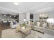 Open-concept living room featuring neutral tones, with access to a kitchen and dining area at 211 Explorer Dr # 263, Morrisville, NC 27560