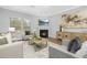 Cozy living room with a fireplace, mantle with television, and a neutral color palette at 211 Explorer Dr # 263, Morrisville, NC 27560