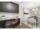 Office area with custom cabinetry adjacent to a dining room for seamless living at 211 Explorer Dr # 263, Morrisville, NC 27560