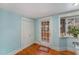 Bright entryway with hardwood floors, white trim, a window, and a door with glass panes to the outdoors at 2122 Woodland Ave, Raleigh, NC 27608