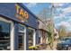 Eye-catching storefront with vibrant blue brick and cheerful orange signage for Tao Boba Tea, inviting potential customers at 2122 Woodland Ave, Raleigh, NC 27608