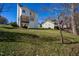 Backyard featuring a house with a small deck and porch, and a lawn at 213 Yellow Poplar Ave, Wake Forest, NC 27587