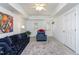 Finished basement area with decor, furniture, walk out access and neutral colored carpet at 213 Yellow Poplar Ave, Wake Forest, NC 27587