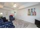Finished basement with walkout access, comfortable seating and decor at 213 Yellow Poplar Ave, Wake Forest, NC 27587