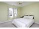 Bedroom with a comfortable bed and pillows, two windows, carpet and a ceiling fan at 213 Yellow Poplar Ave, Wake Forest, NC 27587